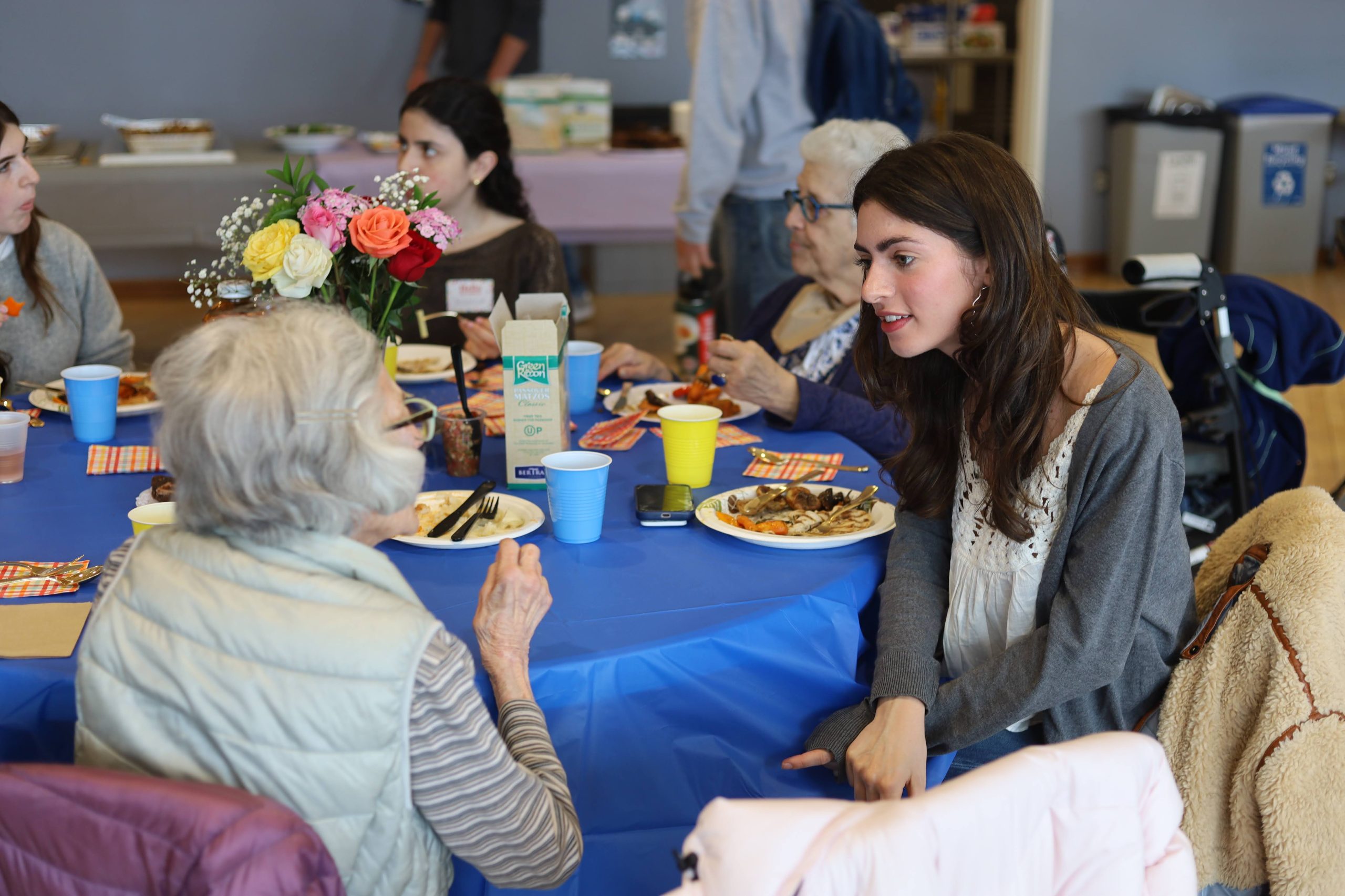 Tufts student speaking with a Cabot Park Village resident